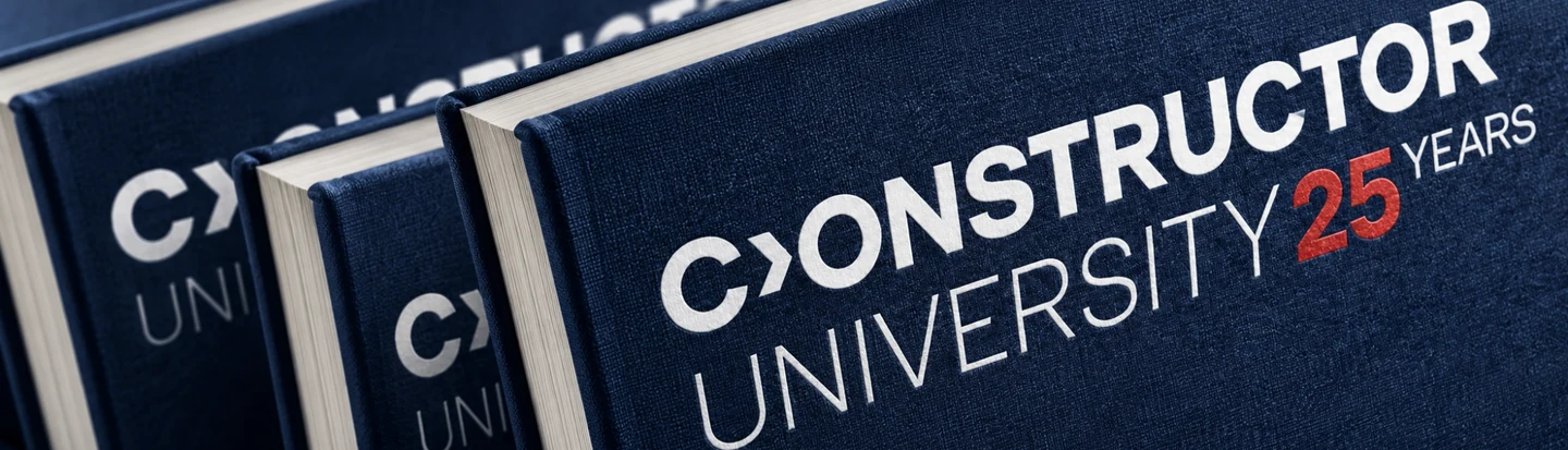 Constructor University 25th anniversary branding on navy notebooks.
