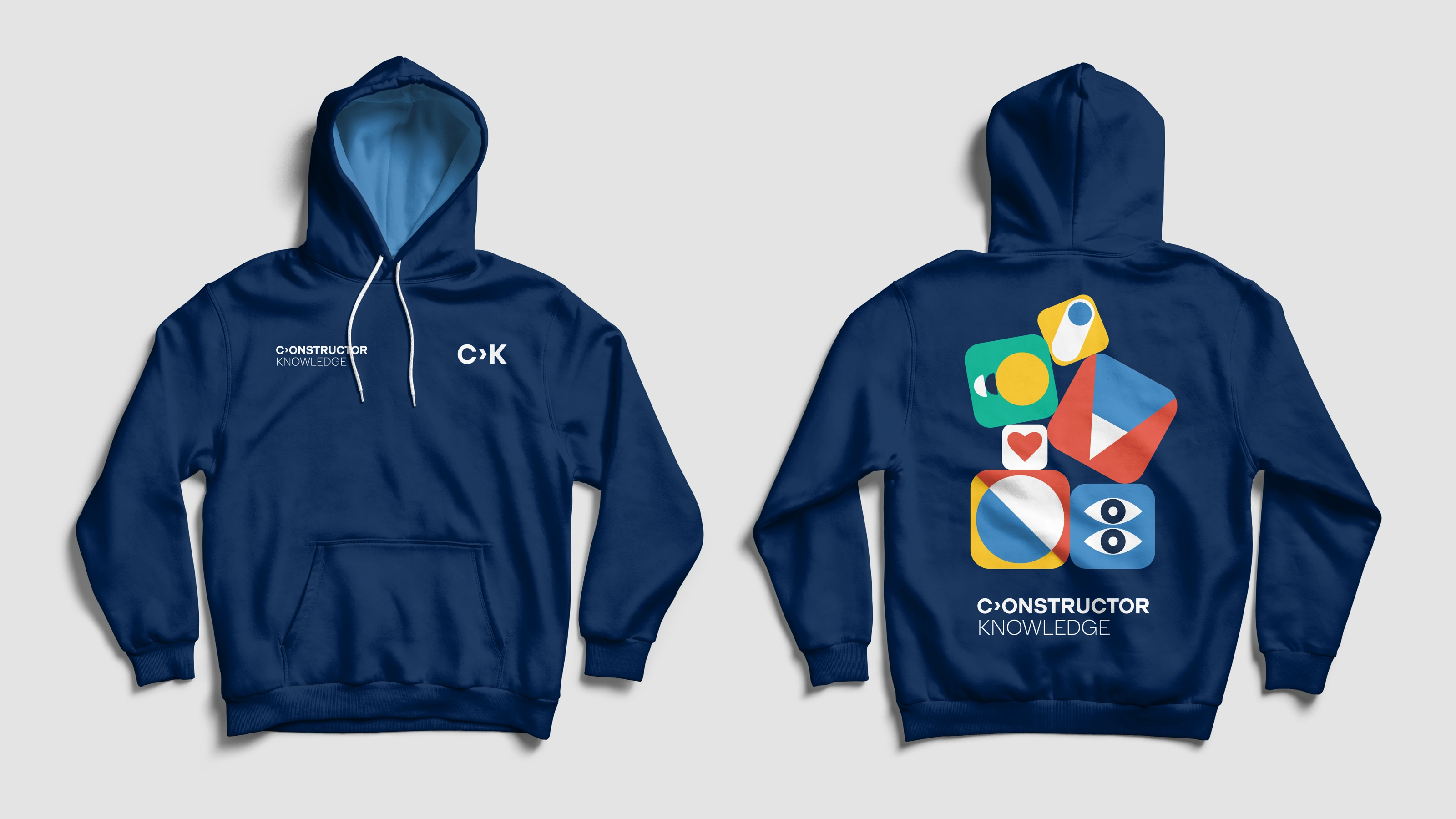 Front and back of a navy Constructor Knowledge hoodie with colourful geometric illustrations