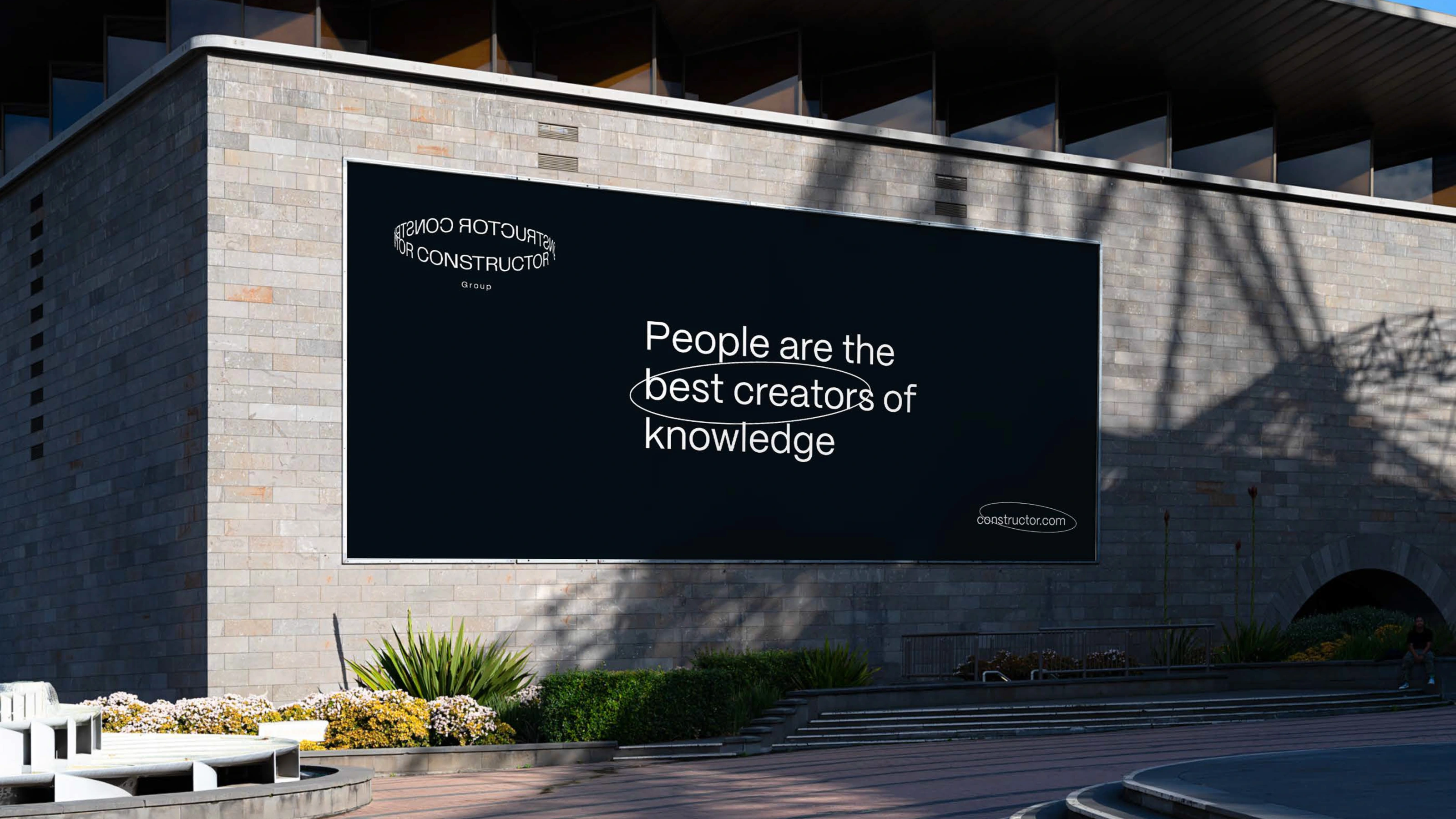 Early loop-shaped Constructor wordmark applied to a billboard